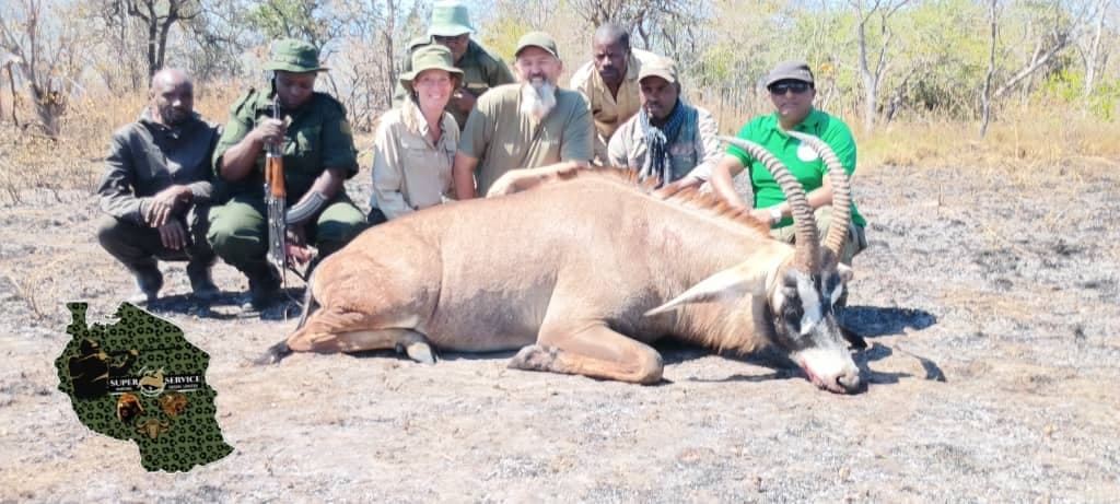 Post-hunt field photograph with TAWA officials, Rungwa North Open Area Tanzania